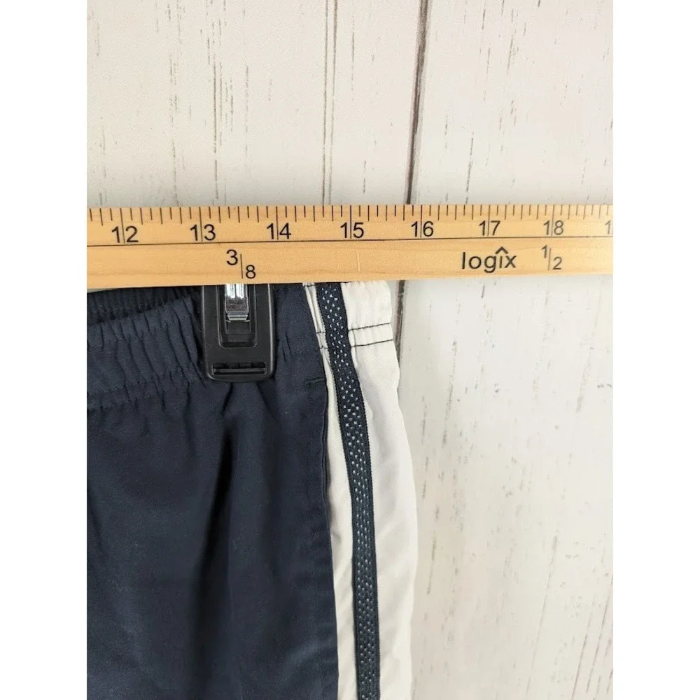 Under Armour Size Medium Dark Blue White Stripe Active Windbreaker Crop‎ Pants - Picture 4 of 7